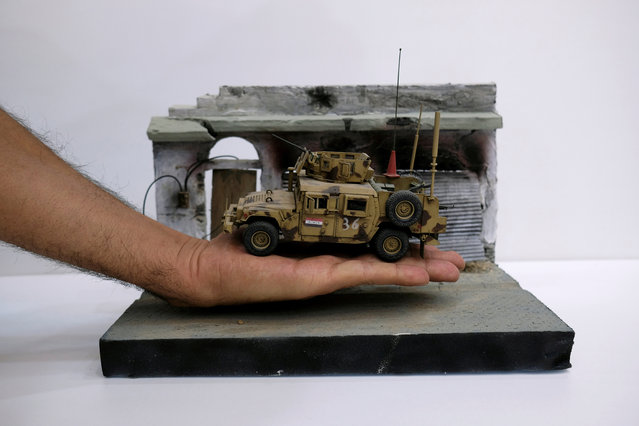 A diorama showing an Iraqi Army vehicle is seen at the home of its creator Radwan Nasser Abdel Amir, a former Iraqi soldier, 28, in Kerbala, Iraq on April 4, 2018. (Photo by Abdullah Dhiaa Al-deen/Reuters)