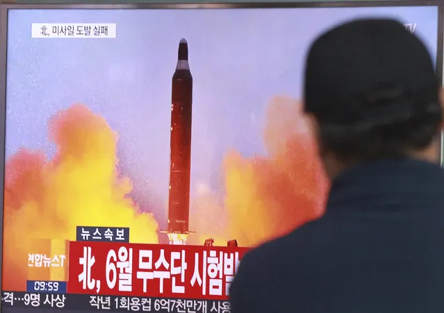 A man watches a TV news program showing a file image of a missile launch conducted by North Korea, at the Seoul Railway Station in Seoul, South Korea, Sunday, October 16, 2016. South Korea and the U.S. said Sunday that the latest missile launch by North Korea ended in a failure after the projectile exploded soon after liftoff. The letters read: North attempted to fire a mid-range Musudan missile on June. (Photo by Ahn Young-joon/AP Photo)