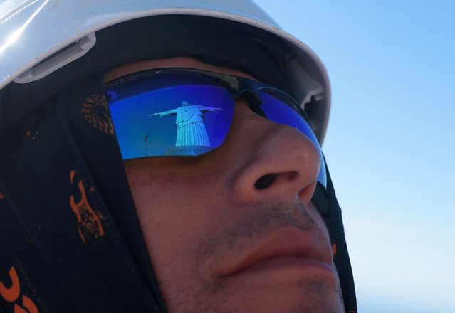 Comlurb climbers clean the slopes surrounding the Christ the Redeemer Sanctuary in Corcovado on September 10, 2025. The professionals, who receive specialized training and use rappelling techniques, work mainly on slopes in communities and areas that are difficult to access. The action is a partnership with the Christ the Redeemer Sanctuary, with which Comlurb has a long-standing relationship. The climber street cleaners are certified as N1 Rope Access Professionals by ANEAC (National Association of Rope Access and Rescue Companies) for working at height/rope access in safety. (Photo by Fabio Teixeira/Anadolu via Getty Images)