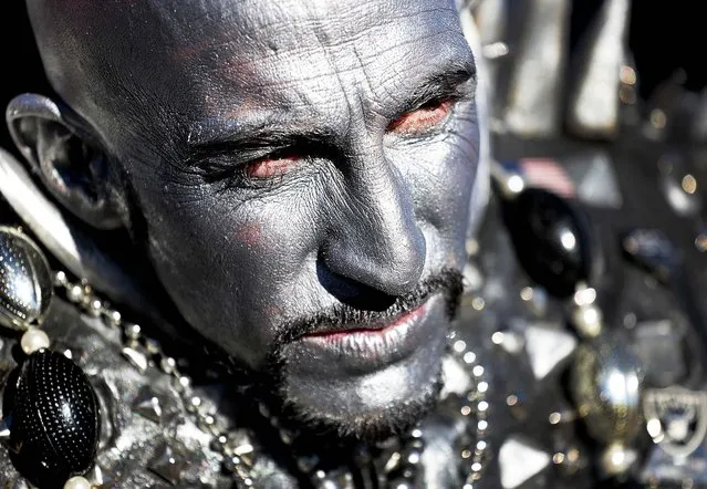 An Oakland Raiders fan tailgates prior to an NFL football game against the Denver Broncos, Sunday, December 28, 2014, in Denver. (Photo by Joe Mahoney/AP Photo)