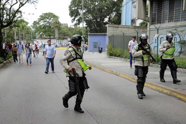 Demonstrators clash with riot police during a student rally demanding a referendum to remove Venezuela's President Nicolas Maduro in Caracas, Venezuela October 24, 2016. (Photo by Marco Bello/Reuters)