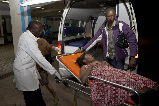 A survivor of a multi-storey building collapse arrives for treatment at Kenyatta National Hospital in the capital Nairobi, Kenya Sunday, January 4, 2015. (Photo by Sayyid Azim/AP Photo)