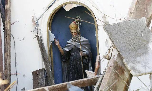 A view of the inside of the Church of St. Antony, dating back to the XIV century, in the small town of Visso in central Italy, Thursday, October 27, 2016, after a 5.9 earthquake destroyed part of the town. A pair of strong aftershocks shook central Italy late Wednesday, crumbling churches and buildings, knocking out power and sending panicked residents into the rain-drenched streets just two months after a powerful earthquake killed nearly 300 people. (Photo by Alessandra Tarantino/AP Photo)