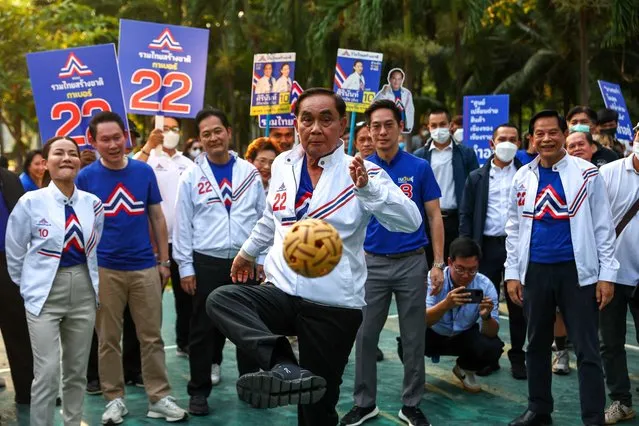 Thailand's Prime Minister Prayuth Chan-ocha, the prime ministerial candidate from the United Thai Nation Party (Ruam Thai Sang Chart Party), plays sepak takraw during the upcoming general election campaign at Lumpini Park, in Bangkok, Thailand on April 20, 2023. (Photo by Athit Perewongmetha/Reuters)