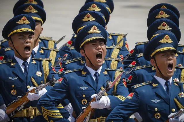 Chinese honour guards march in formation during a welcoming ceremony for Russian Prime Minister Mikhail Mishustin in Beijing on May 24, 2023. (Photo by Thomas Peter/Pool via AFP Photo)