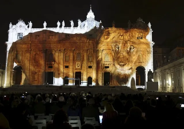 A picture of a lion, part of an art projection featuring images of humanity and climate change artistically rendered by Obscura Digital, is projected onto the facade of St. Peter's Basilica, as part of an installation entitled “Fiat Lux: Illuminating our Common Home” as a gift to Pope Francis on the opening day of the Extraordinary Jubilee, at the Vatican, December 8, 2015. (Photo by Stefano Rellandini/Reuters)