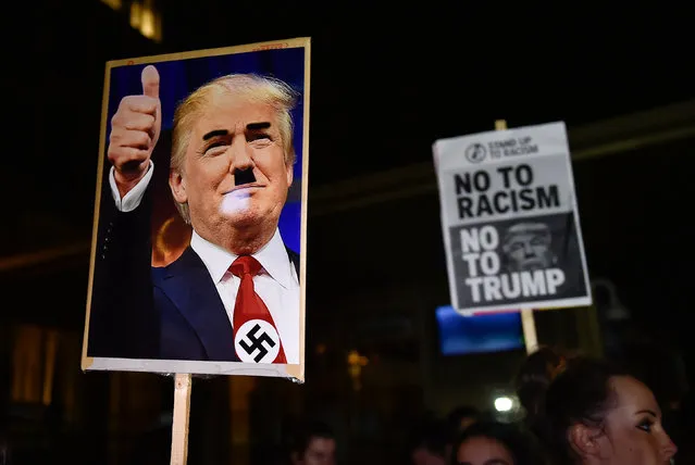 People hold placards at an anti-racism protest against U.S. President-elect Donald Trump outside of the U.S. Embassy in London, Britain, November 9, 2016. (Photo by Hannah McKay/Reuters)