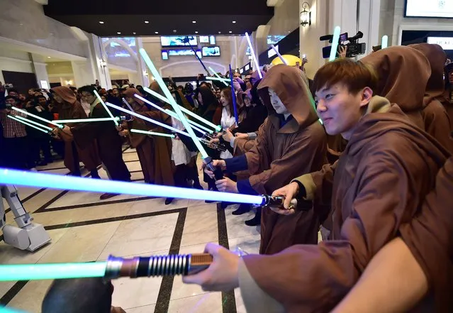 South Korean fans dressed as Star Wars characters attend a Jedi parade before a release of the movie “Star Wars: The Force Awakens” at Lotte Cinema in Seoul on December 16, 2015. (Photo by Jung Yeon-Je/AFP Photo)