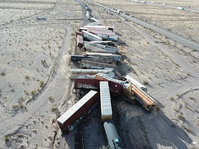 A derailed cargo train in the southern California desert on March 2021 that sent more than two dozen rail cars crashing into the sand. No one was hurt and there was no fire when the train went off the tracks near the remote Mojave community of Ludlow. (Photo by AP Photo/Stringer)