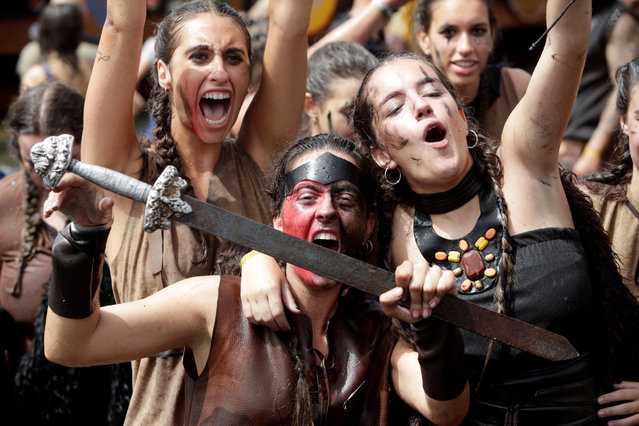 Women dressed up as Vikings attend the annual Viking festival of Catoira in north-western Spain on August 5, 2018. (Photo by Miguel Vidal/Reuters)
