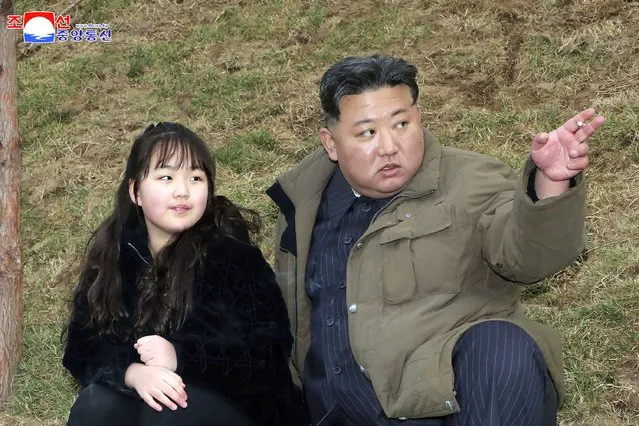 This photo provided April 14, 2023, by the North Korean government, shows North Korean leader Kim Jong Un, right, and his daughter, as they inspect what it says is the test-launch of Hwasong-18 intercontinental ballistic missile Thursday, April 13, 2023 at an undisclosed location, North Korea. Independent journalists were not given access to cover the event depicted in this image distributed by the North Korean government. The content of this image is as provided and cannot be independently verified. Korean language watermark on image as provided by source reads: “KCNA” which is the abbreviation for Korean Central News Agency. (Photo by Korean Central News Agency/Korea News Service via AP Photo)