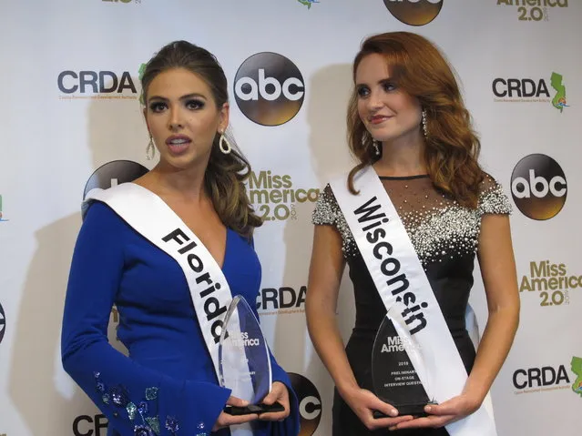 Miss Florida, Taylor Tyson, left, and Miss Wisconsin, Tianna Vanderhei, talk to the media after the first night of preliminary competition at the Miss America competition in Atlantic City, N.J., Wednesday, September 5, 2018. Tyson won the talent competition and Vanderhei won the onstage interview competition. (Photo by Wayne Parry/AP Photo)