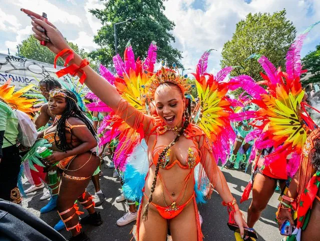 Participants in feathered costumes representing birds of the tropics taking part in the carnival parade in London, United Kingdom on August 28, 2023. The Notting Hill Carnival is Europe's largest street festival, which celebrates Caribbean culture, is expected to attract over 1 million revellers on bank holiday monday. (Photo by Amer Ghazzal/Rex Features/Shutterstock)