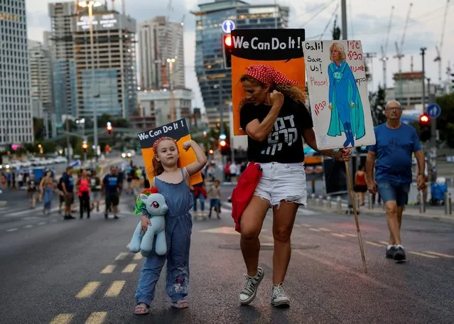 People take part in a demonstration against Israeli Prime Minister Benjamin Netanyahu and his nationalist coalition government's judicial overhaul, in Tel Aviv, Israel on September 2, 2023. (Photo by Amir Cohen/Reuters)