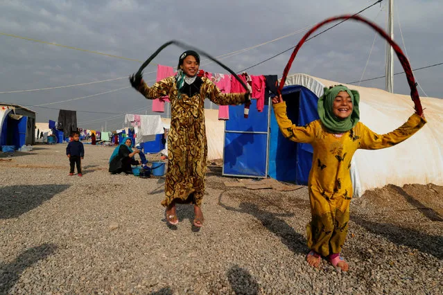 Displaced Iraqi girls, who fled the Islamic State stronghold of Mosul, play at Khazer camp, Iraq December 13, 2016. (Photo by Ammar Awad/Reuters)