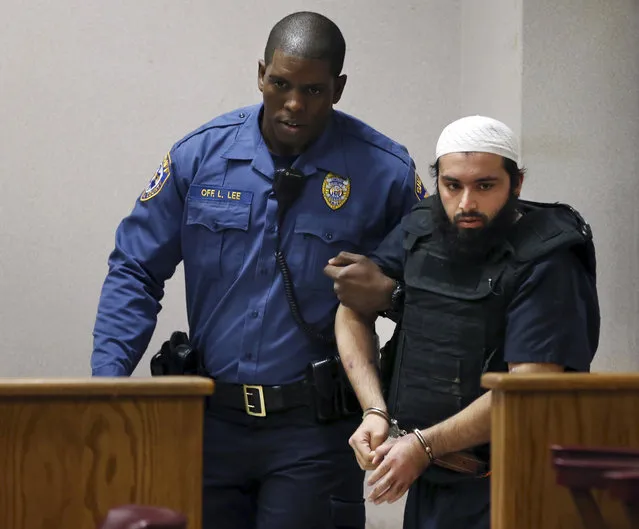 Ahmad Khan Rahimi, the man accused of setting off bombs in New Jersey and New York in September, injuring more than 30 people, is led into court Tuesday, December 20, 2016, in Elizabeth, N.J. (Photo by Mel Evans/AP Photo)