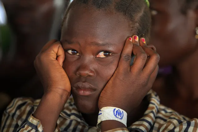 A girl who fled fighting in South Sudan queues on arrival at Bidi Bidi refugee’s resettlement camp near the border with South Sudan, in Yumbe district, northern Uganda December 7, 2016. (Photo by James Akena/Reuters)