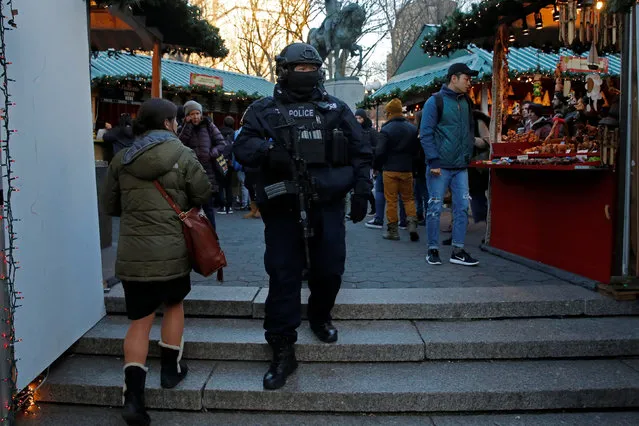 A member of the New York Police Department's Counterterrorism Bureau patrols the Union Square Holiday market following the Berlin Christmas market attacks in Manhattan, New York City, U.S., December 20, 2016. (Photo by Andrew Kelly/Reuters)