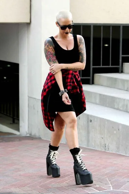 Amber Rose out shopping at Neiman Marcus in Beverly Hills wearing a black and red checked shirt around her waist in Los Angeles, California, on January 22, 2014. (Photo by WENN/SIPA Press)