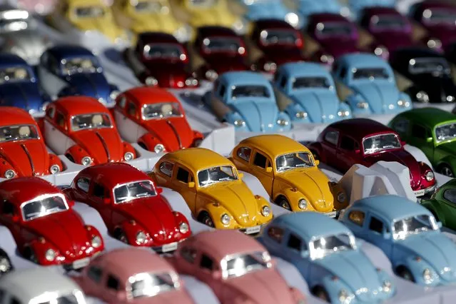 Miniature models of Volkswagen beetles are displayed during a Volkswagen Beetle owners' meeting in Sao Bernardo do Campo, Brazil, in this January 25, 2015 file photo. VW is expected to report Q1 results this week. (Photo by Paulo Whitaker/Reuters)