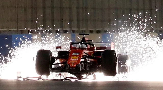 Ferrari's Sebastian Vettel steers his damaged car during the Formula One Bahrain Grand Prix at the Sakhir circuit in the desert south of the Bahraini capital Manama, March 31, 2019. (Photo by Thaier Al-Sudani/Reuters)