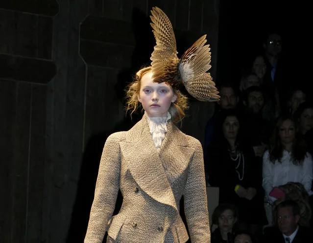 Models walk the catwalk at the Alexander McQueen fashion show at Paris Fashion Week (Pret-a-Porter) Autumn/Winter 2006/7 on March 3, 2006 in Paris, France. (Photo by Michel Dufour/WireImage)