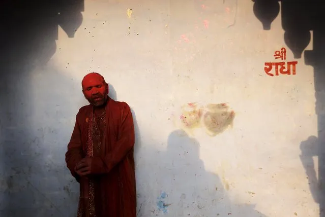 A Hindu devotee takes part in the religious festival of Holi, also known as the festival of colours, in the Nandgaon temple in Mathura in the Uttar Pradesh region of India, March 18, 2016. (Photo by Anindito Mukherjee/Reuters)