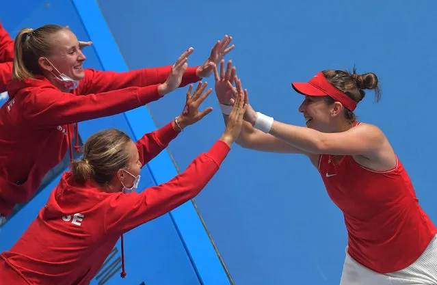 Belinda Bencic of Switzerland (R) celebrates with teammates after she defeated Anqelika Kerber of Germany (not pictured) in their group tennis match of the Billie Jean King Cup finals on November 2, 2021 in Prague. (Photo by Michal Cizek/AFP Photo)