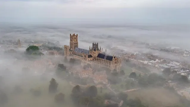 Ely cathedral in Cambridgeshire, United Kingdom is shrouded in mist yesterday morning, October 9, 2021. Today most areas of the country will be dry with sunny spells. (Photo by Geoff Robinson Photography)