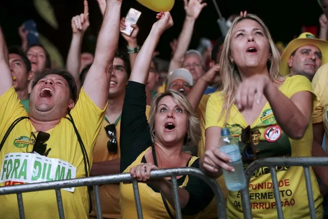 Brazilians in favor of the impeachment of President Dilma Rousseff react while watching the televised voting of the Lower House of Congress over her impeachment in Brasilia, Brazil April 17, 2016. (Photo by Adriano Machado/Reuters)
