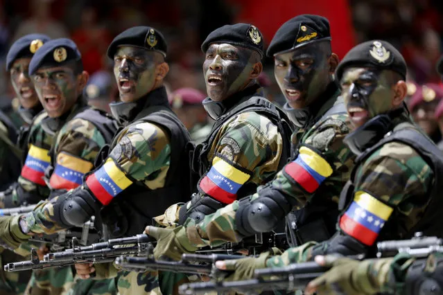 Soldiers march during a military parade marking Independence Day in Caracas, Venezuela, Friday July 5, 2019. Venezuela is marking 208 years of their declaration of independence from Spain. (Photo by Ariana Cubillos/AP Photos)