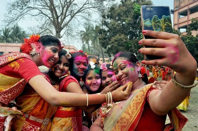 Students take Selfie during Holi celebration in a school at Beldanga in Murshidabad district of West Bengal on Saturday, March 11, 2017. (Photo by Sanjib Kumar Pramanik/PTI Photo)