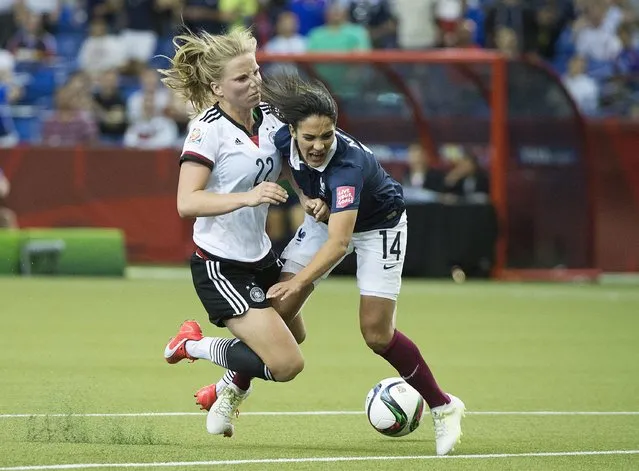 Germany's Tabea Kemme, left, knocks France's Louisa Necib off the ball during the first half of extra time in a FIFA Women's World Cup quarterfinal soccer game, Friday, June 26, 2015, in Montreal, Canada. (Photo by Graham Hughes/The Canadian Press via AP Photo)