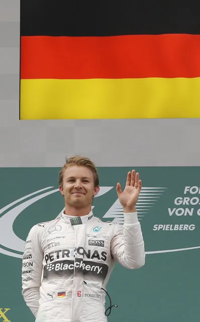 Mercedes driver Nico Rosberg of Germany celebrates his victory in the Formula One Grand Prix race, at the Red Bull Ring in Spielberg, southern Austria, Sunday, June 21, 2015. (AP Photo/Darko Bandic)