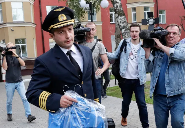 Damir Yusupov, 41, the captain of Ural Airlines A321, walks to attend a news conference in Ramenskoye, just outside Moscow, Russia, Thursday, August 15, 2019. The captain of a Russian passenger jet was hailed as a hero Thursday for landing his plane in a cornfield after it collided with a flock of gulls seconds after takeoff, causing both engines to malfunction. (Photo by Vladimir Shatilov/AP Photo)