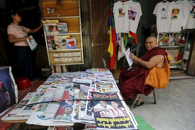 Pictures of Myanmar's new President Htin Kyaw and National League for Democracy party leader Aung San Suu Kyi are seen displayed in local newspaperS at a news stand in Yangon March 17, 2016. (Photo by Soe Zeya Tun/Reuters)
