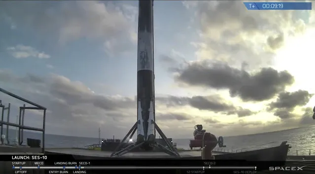 This image made available by SpaceX shows the company's booster rocket after a successful vertical landing in the Atlantic Ocean just off the east Florida coast Thursday, March 30, 2017. SpaceX launched its first recycled rocket Thursday, the biggest leap yet in its bid to drive down costs and speed up flights. (Photo by SpaceX via AP Photo)