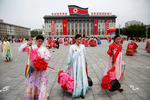 Participants leave the capital's main ceremonial square after a mass rally and parade, a day after the ruling party wrapped up its first congress in 36 years by elevating him to party chairman, in Pyongyang, North Korea, May 10, 2016. (Photo by Damir Sagolj/Reuters)