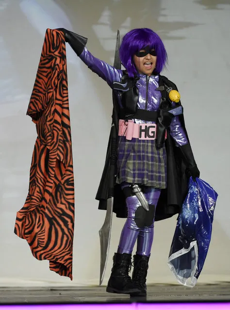 Contestant Alyssa Morales performs as “Happy Happy HitGirl” during the 41st Annual Comic-Con Masquerade costume competition on Saturday, July 11, 2015, in San Diego, Calif. (Photo by Chris Pizzello/Invision/AP Photo)