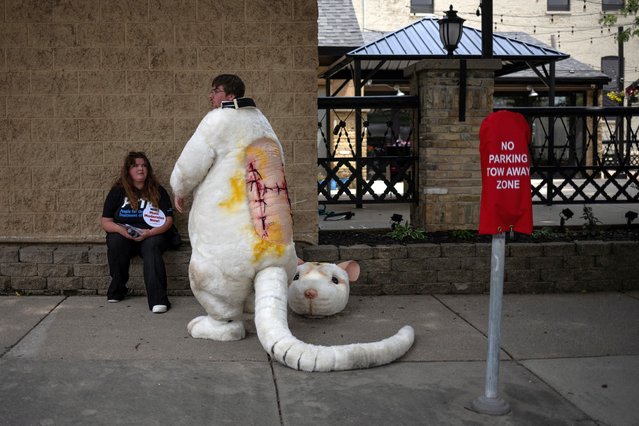 Nathan Edwards, an activist with PETA, rests after taking part in a demonstration on the sidelines of Republican National Convention in Milwaukee, Wisconsin, U.S., July 15, 2024. (Photo by Adrees Latif/Reuters)