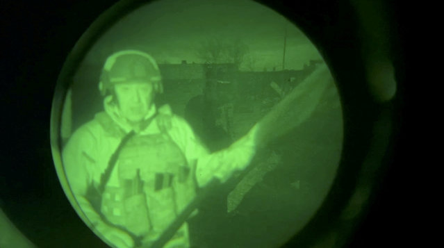 Yevgeny Prigozhin, founder of Russia's Wagner mercenary force, speaks in a video message that was allegedly filmed near the city administration building in Bakhmut, Ukraine, in this still image from an undated video filmed through a night vision device and released on April 3, 2023. (Photo by Concord Press Service/Handout via Reuters)