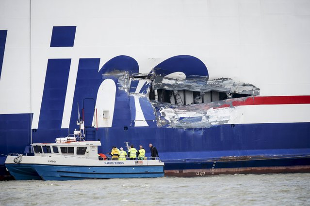 A hole on the side of Stena Line passenger ferry Stena Jutlandica is being inspected in the harbour of Gothenburg, Sweden, July 19, 2015. The ferry collided early Sunday morning with a tanker off the island of Vinga outside Gothenburg. The ferry was taking in water but managed to reach the harbour without any assistance. The tanker was carrying 12,000 tons of diesel and petrol but there are no reports of any oil leakage. The cause of the accident is being investigated. (Photo by Adam Ihse/Reuters/TT News Agency)