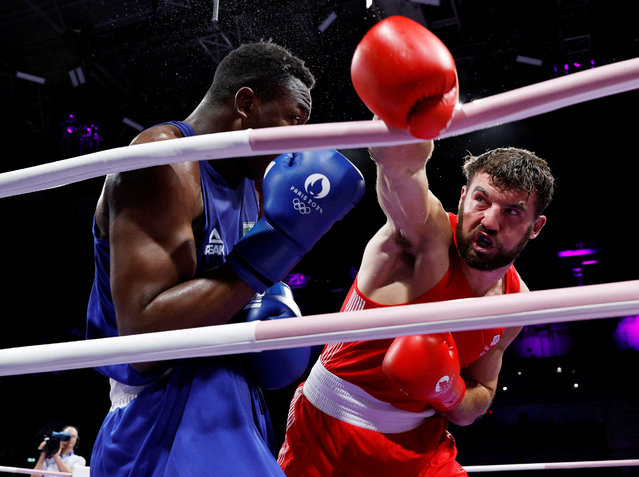 Patrick James Brown of Britain in action against Keno Marley Machado of Brazil during the men's boxing 92kg round of sixteen on July 28, 2024. (Photo by Peter Cziborra/Reuters)