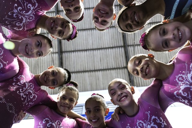 Gymnasts pose for a photo at Bonifacio Cardoso gymnasium, where Olympic medalist Rebeca Andrade trained as a child in her hometown of Guarulhos, Sao Paulo, Brazil, Tuesday, August 6, 2024. (Photo by Tuane Fernandes/AP Photo)