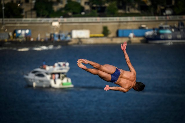 In this handout image provided by Red Bull, Jonathan Paredes of Mexico dives from the 27 metre platform during the second competition day of the sixth stop of the Red Bull Cliff Diving World Series on August 24, 2024 at Montreal, Canada. (Photo by Romina Amato/Red Bull via Getty Images)