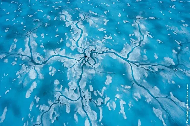 Spring in the Arctic, traces of meltwater runoff sprawled on the ice