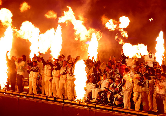 Athletes celebrate on-stage during the closing ceremony of the Paris 2024 Summer Paralympic Games at the Stade de France in Paris, France on September 8, 2024. (Photo by Umit Bektas/Reuters)