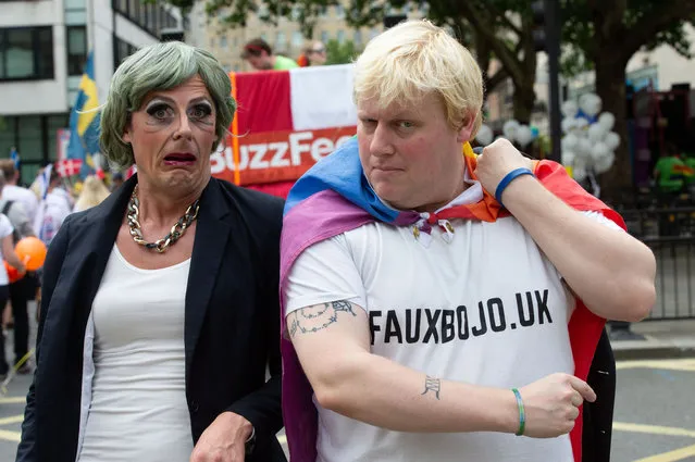 A fake Theresa May and Boris Johnson join Members of the Lesbian, Gay, Bisexual and Transgender community (LGBT) and their supporters, as they gather in central London, England for the annual Pride parade on July 6, 2019. (Photo by Mark Thomas/Rex Features/Shutterstock)