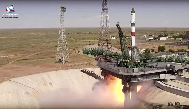 In this photo taken from video released by the Roscosmos Space Agency, the Soyuz-2.1a rocket booster with cargo transportation spacecraft Progress МS-20 blasts off at the Russian leased Baikonur cosmodrome, Kazakhstan, Friday, June 3, 2022. The second stage of the rocket bears the inscription “Donbass” and its nose cone has the flags of the Donetsk and Lugansk People's Republics painted on it. (Photo by Roscosmos Space Agency via AP Photo)