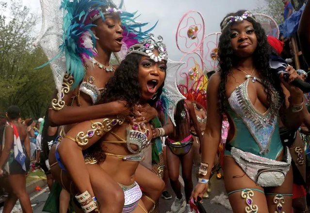 Parade-goers walk in the annual West Indian Day Parade on September 02, 2019 in the Brooklyn borough of New York City. The annual celebration of Caribbean culture is one of the largest of its kind and features dozens of floats and costumed participants that make their way down Flatbush Avenue. (Photo by Yana Paskova/Getty Images)